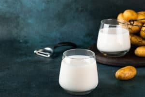 vegan-potato-milk-glass-potato-bowl-dark-background-vegan-milk-plant-based-milk-replacer-lactose-free-vegetable-milk