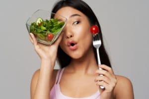 woman-asian-appearance-plate-with-salad-healthy-food-vegetables