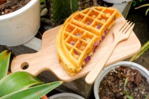 delicious-waffles-purple-sweet-potato-flavour-wooden-plate-garden