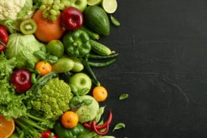 healthy-food-dish-black-stone-background-healthful-set-including-vegetables-fruits-grape-apple-kiwi-pepper-lime-cabbage-zucchini-grapefruit-proper-nutrition-vegetarian-menu (1)