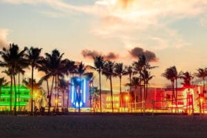 miami-beach-ocean-drive-panorama-with-hotels-restaurants-sunset-city-skyline-with-palm-trees