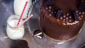 chocolate-cake-decorated-with-biscuits-jars-milk