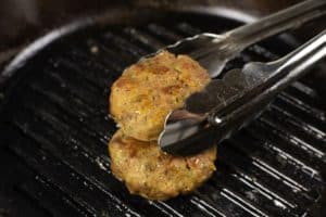 homemade-burger-patties-cutlet-beef-pork-chicken-turkey-black-cast-iron-frying-pan-table-meat-tongs-ketogenic-carnivore-low-carb-diet-concept-close-up-selective-focus-copy-space_137271-296