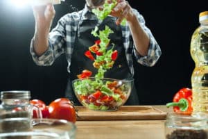 preparing-salad-female-chef-cutting-fresh-vegetables