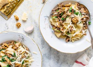 Creamy Vegan Pasta Served With Sauteed Mushrooms and Brussels Sprouts